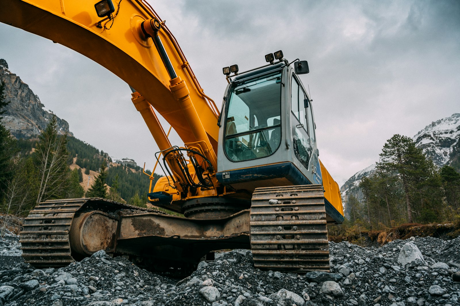 An excavator conducting ground investigation work on a construction site